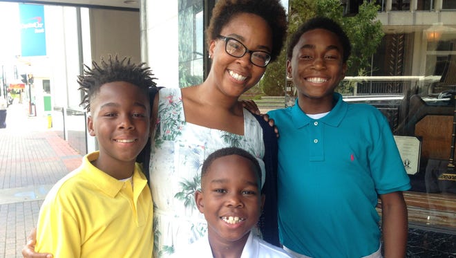 Ashley Grant with her sons (from left) Ashton, Aiden-Noah and Ivory Grant.