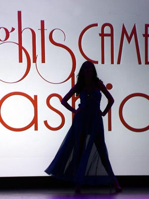 A model prepares to walk the runway at the 2014 Lights Camera Fashion of Tennessee’s Third annual Prom Fashion Show in this file photo.