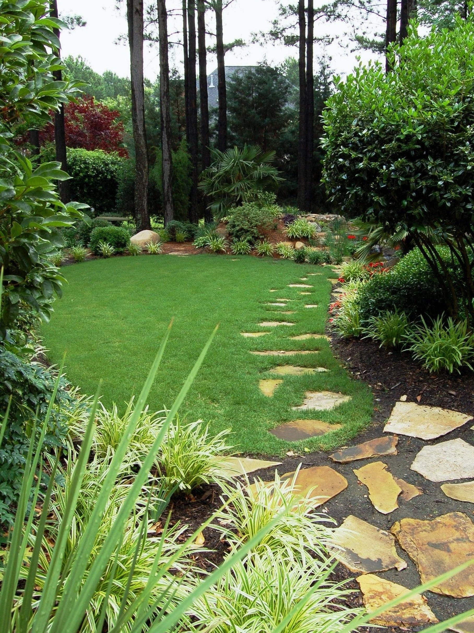 You're edging the grass around your garden beds wrong. Here are 4 ways to get it right