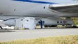 Technicians work on the Pegasus XL rocket slung beneath