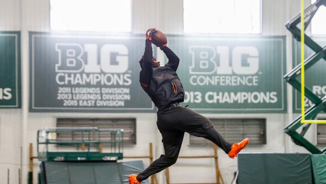 Former Michigan State wide receiver Aaron Burbridge, who ran a 4.45-second 40-yard dash Wednesday, looked sharp in drills at pro day.
