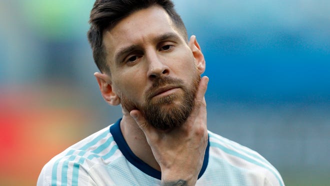 Argentina's Lionel Messi strokes his beard prior a Copa America Group B soccer match against Qatar at Arena do Gremio, Porto Alegre, Brazil, Sunday, June 23, 2019. (AP Photo/Victor R. Caivano)