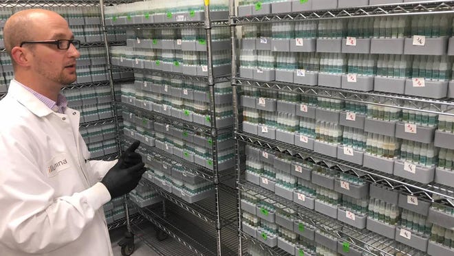 Jay Antico, manager of clinical lab, stands before tubes of saliva that consumers have sent to Ancestry for DNA analysis on April 12, 2018 at the Illumina headquarters in La Jolla, Cal.