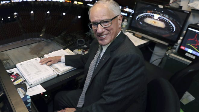 NBC hockey broadcaster Mike Emrick poses for a photo in May 2019 while preparing to call Game 2 of the NHL hockey Stanley Cup Final between the St. Louis Blues and the Boston Bruins, in Boston.