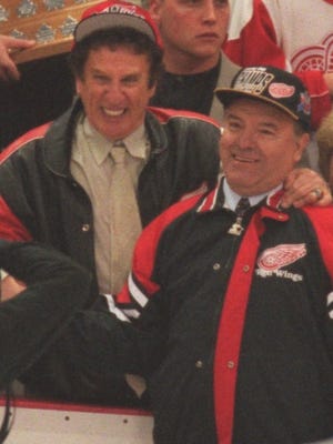 Red Wings owner Mike Ilitch hugs coach Scotty Bowman after their Stanley Cup win over the Flyers June 7, 1997, at Joe Louis Arena.
