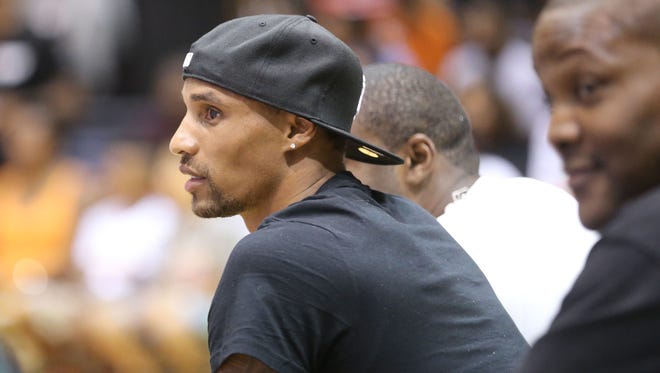 George Hill watches his team in the first half. Ten local players won spots on a team that played the Ball Up All Stars in a game at Tech High School Sunday July 6, 2014. George Hill of the Pacers coached the local players.