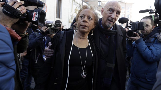 Sex abuse survivors, Denise Buchanan and Peter Isely, both founding members of the ECA (Ending Clergy Abuse), make their way through a crowd of journalists on the occasion of their meeting with organizers of the summit on preventing sexual abuse at the Vatican, Feb. 20, 2019.