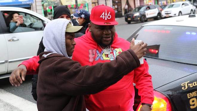 Fans take pictures of entertainer, Fat Boy SSE, before he walks in campaign headquarters for Pedro Rodriguez in Paterson. Sunday April 15, 2018