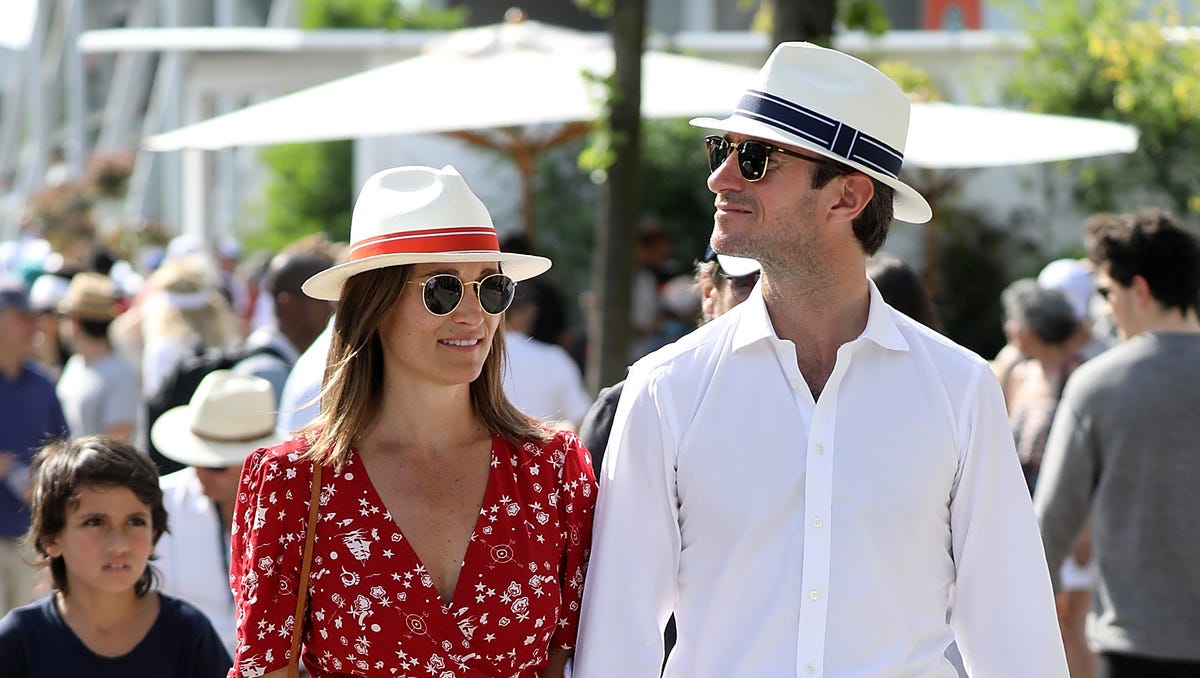 A coordinating couple! Pippa Middleton and husband James Matthews held hands and matched hats on Saturday at the French Open