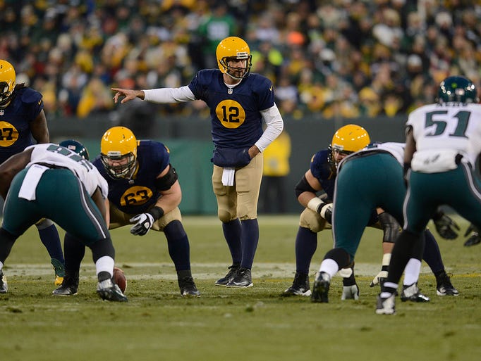 Green Bay Packers quarterback Aaron Rodgers (12) gives