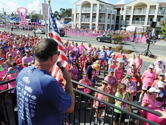 Steve "Monty" Montgomery speaks to the crowd at the Dewey Goes Pink event at The Starboard in October.