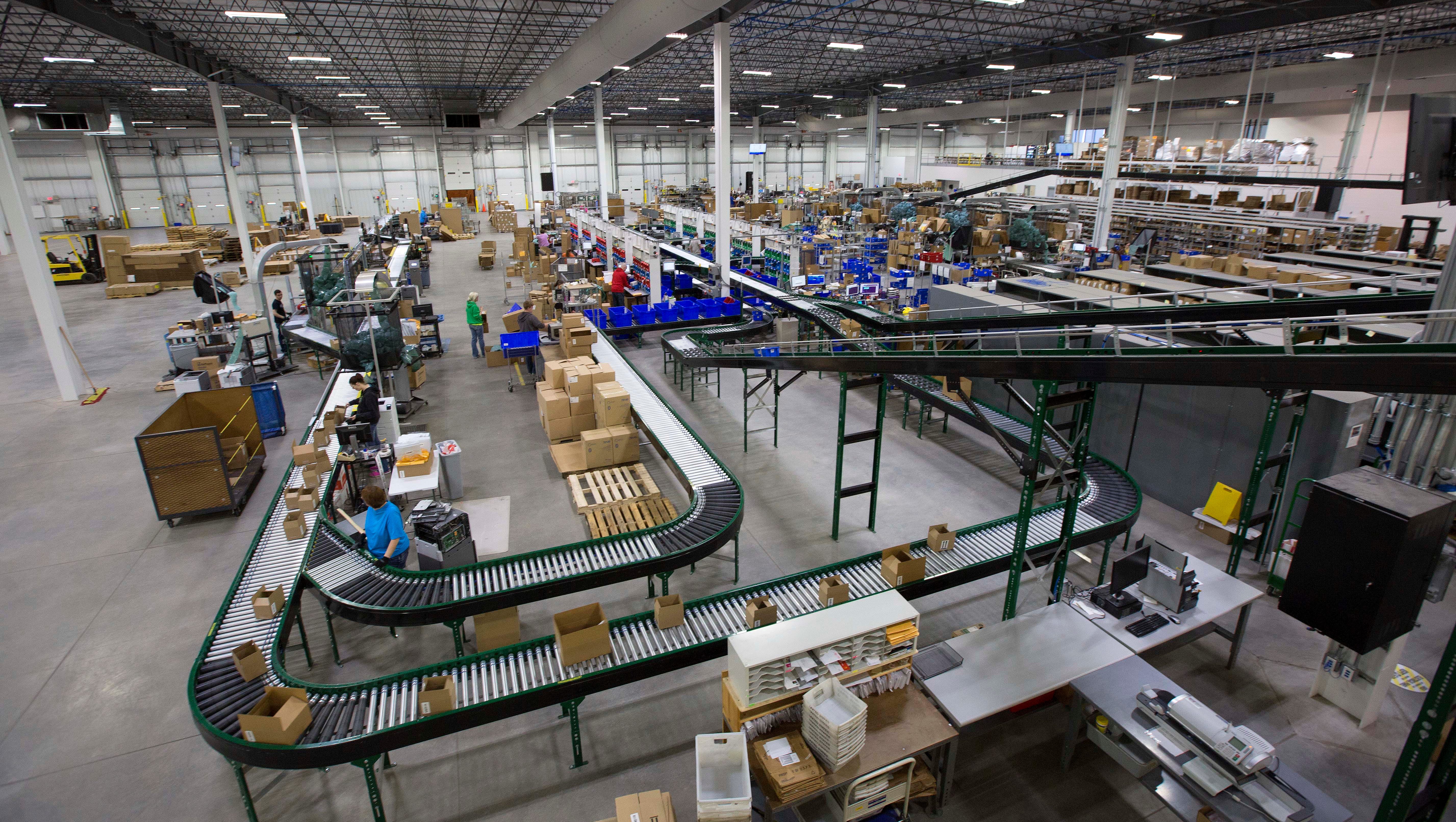 Workers fulfill online and mail orders in a 200,000-square-foot warehouse at Brownells in Grinnel.
