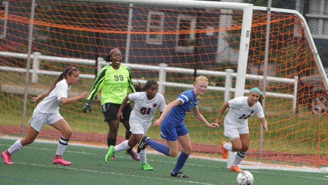 Game action of Ossining and Mahopac girls soccer at Ossining High School on Saturday, September 12th, 2015. The two teams finished to a scoreless draw.