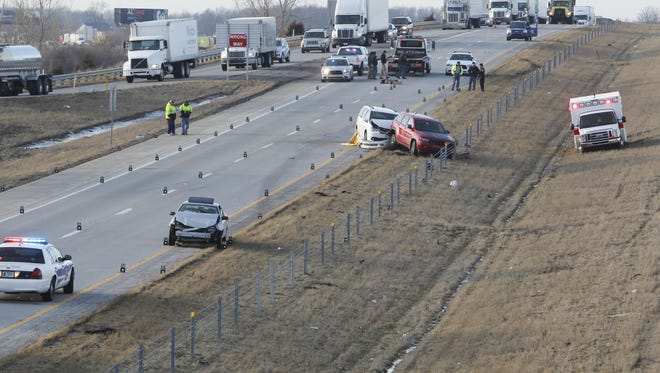 Indiana State Police investigate the Feb. 10 fatal accident on I-65 and Indiana 28. Luke Holm-Hansen jumped from a moving northbound van and tried to cross the interstate on his hands and knees.