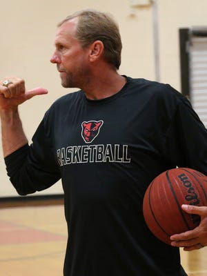 Petal Basketball Coach Todd Kimble gives instructions to his players during practice Thursday.