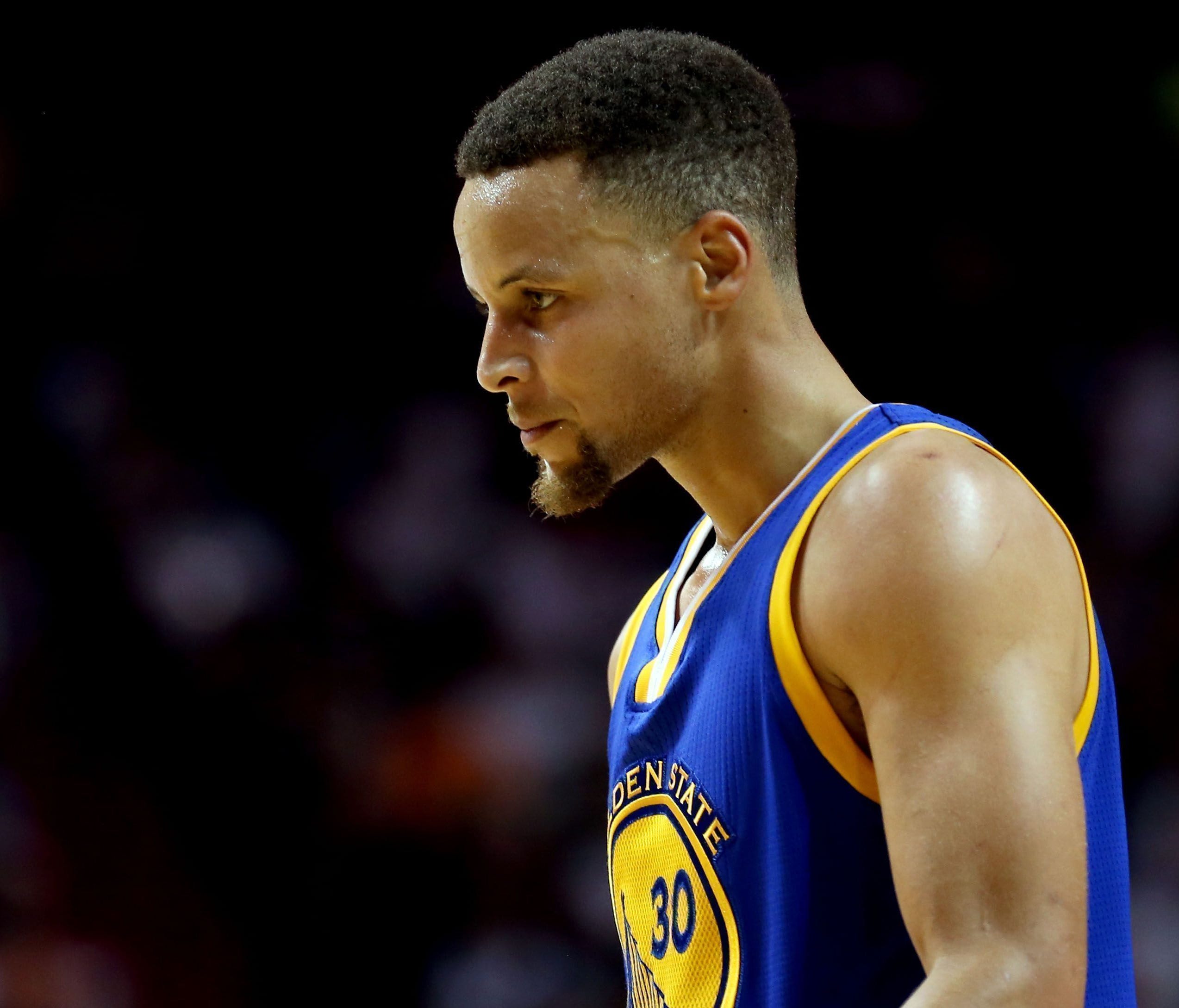 Stephen Curry looks on against the Miami Heat during the second half at American Airlines Arena.