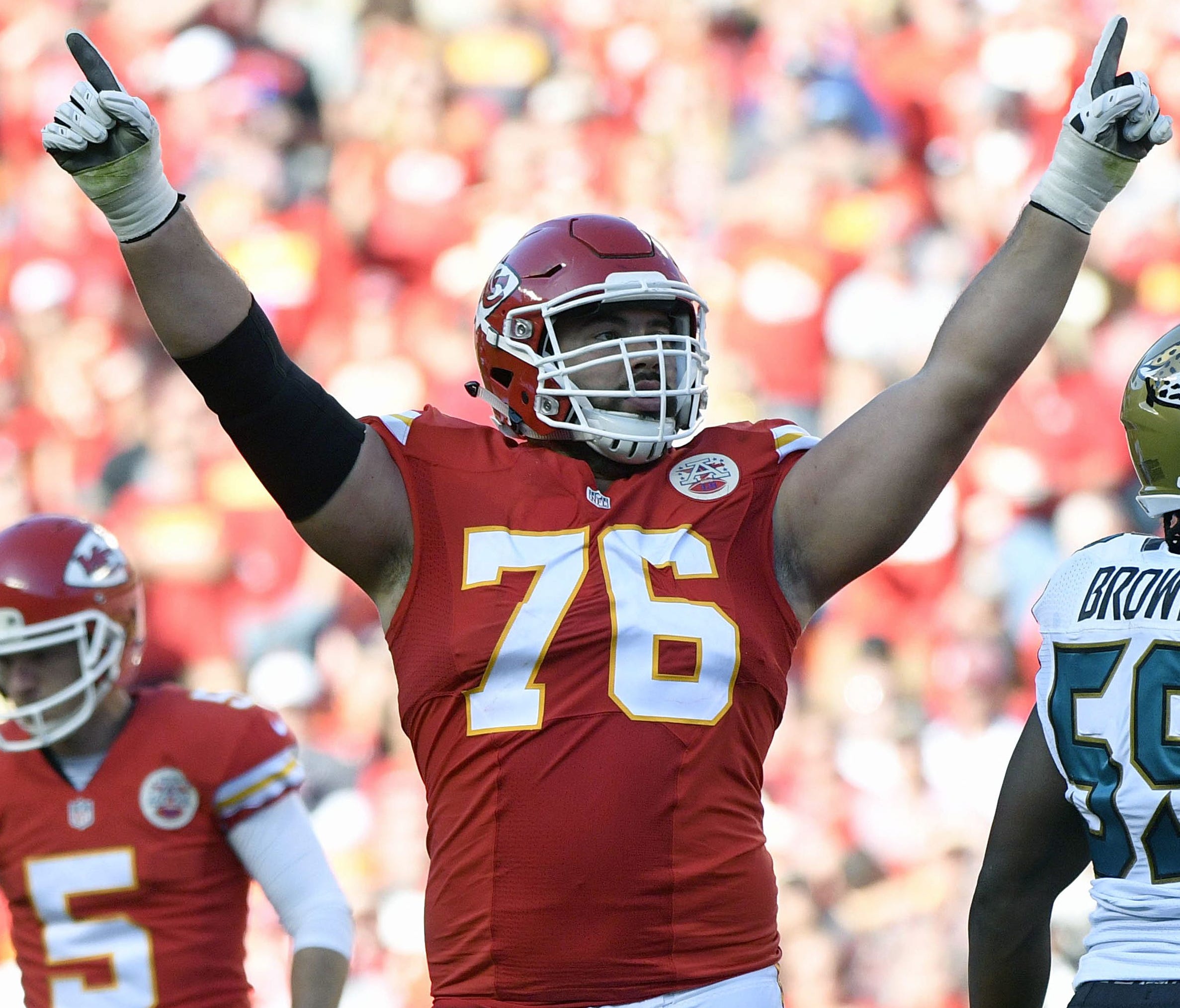 FILE - In this Nov. 6, 2016, file photo, Kansas City Chiefs offensive lineman Laurent Duvernay-Tardif (76) celebrates after a field goal by kicker Cairo Santos (5), during the second half of an NFL football game against the Jacksonville Jaguars in Ka