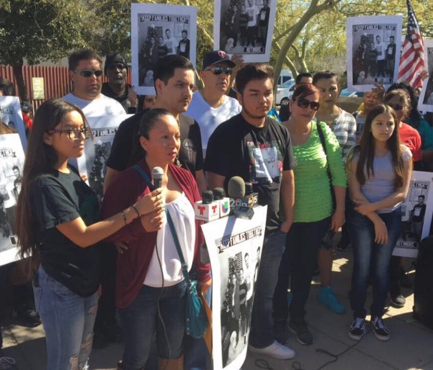 Guadalupe Garcia de Rayos (center, at microphones) on Feb. 8, 2017, addresses supporters who gathered outside the Immigration and Customs Enforcement office in central Phoenix, where she would later learn that she was being deported.