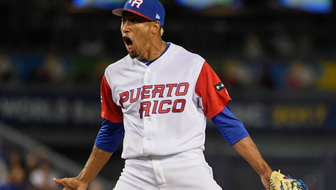 Puerto Rico closer Edwin Diaz celebrates after striking out the side in the ninth inning Monday against The Netherlands in the World Baseball Classic semifinals at Dodger Stadium.