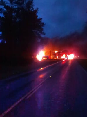 View down the road of a gas station fire in Lawrence County.