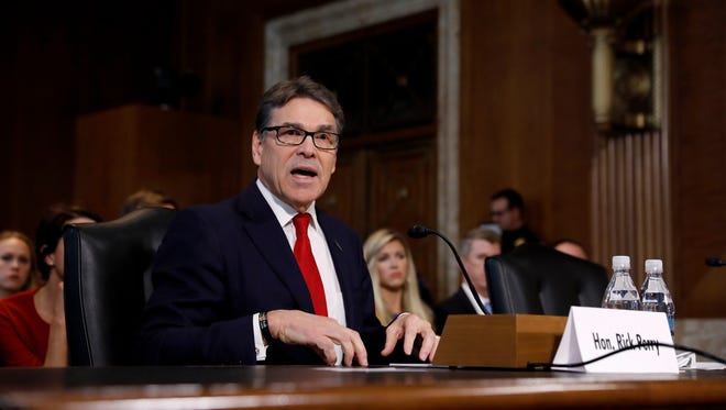 Former Texas Gov. Rick Perry, President Donald Trump's choice for secretary of energy, testifies during his confirmation hearing before the Senate Committee on Energy and Natural Resources on Thursday, Jan. 19, 2017, on Capitol Hill in Washington, D.C. Perry wore a bracelet engraved with the name of Colton W. Rusk, an Orange Grove High School graduate killed in 2010 while serving in Afghanistan.