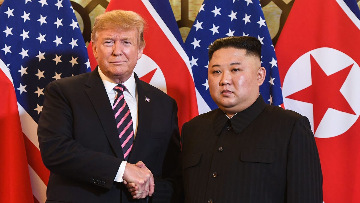 President Donald Trump shakes hands with North Korea's leader Kim Jong Un before a meeting at the Sofitel Legend Metropole hotel in Hanoi on Wednesday.