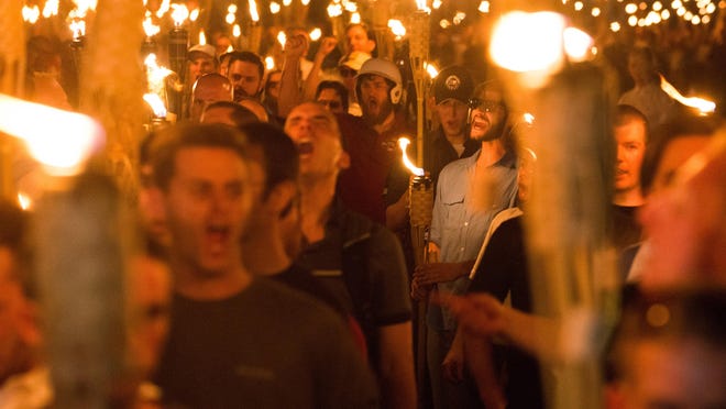 Neo-Nazis, alt-Right, and white supremacists march the night before the "Unite the Right" rally, on Friday, Aug. 11, 2017 through the University of Virginia in Charlottesville, Va. (Zach D Roberts/NurPhoto/Zuma Press/TNS)