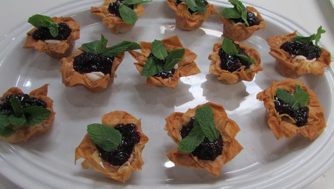How to make Phyllo cups filled with vanilla bean cheesecake mousse  with mixed berry compote.