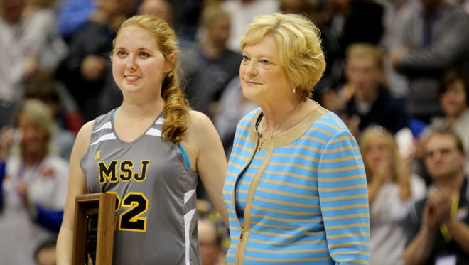 Lauren Hill of Mount St. Joseph University, left, was presented the Pat Summitt Most Courageous Award by the board of the U.S. Basketball Writers Association in November 2014. Summitt, right, was in attendance but did not speak publicly. Hill had an inoperable brain tumor and died April 10, 2015.