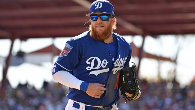 Justin Turner #10 of the Los Angeles Dodgers reacts while running off the field in the spring training game against the Arizona Diamondbacks at Camelback Ranch on March 3, 2018 in Glendale, Arizona.  (Photo by Jennifer Stewart/Getty Images)