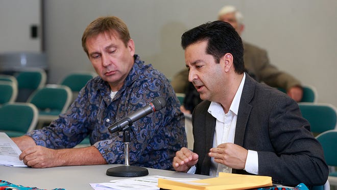 San Juan Generating Station plant manager Tom Fallgren, left, and Public Service Company of New Mexico Government Affairs Manager Carlos Lucero address the state Indian Affairs Committee on Wednesday at San Juan College.