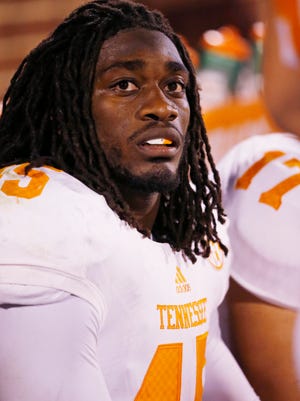 FILE - This Sept. 13, 2014, file photo shows Tennessee linebacker A.J. Johnson (45) during an NCAA college football game between Tennessee and Oklahoma in Norman, Okla. Former Tennessee linebacker A.J. Johnson, who is a subject of a rape investigation, won't be participating in next week's NFL Scouting Combine. NFL spokesman Michael Signora confirmed Friday, Feb. 13, 2015, the league withdrew its invitation to Johnson, who had been on the list of invited players that was released last week. The combine starts Tuesday in Indianapolis. (AP Photo/Sue Ogrocki, File)