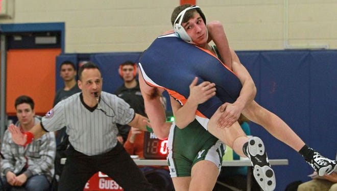 Yorktown's Pat Patierno on his way to pinning Greeley's Alex Baretz in the 138-pound weight class during wrestling action at Horace Greeley High School in Chappaqua Jan. 6, 2016.