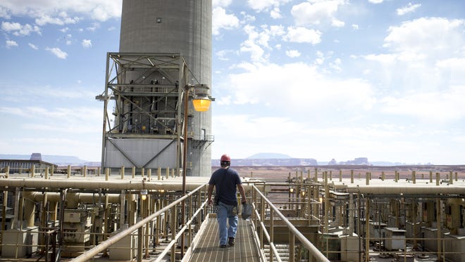 Alex Tsinnjinnie of the operations department walks on the 200-foot level at Navajo Generating Station near Page.