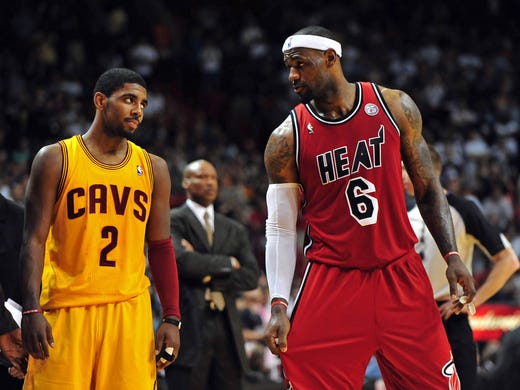 Cleveland Cavaliers point guard Kyrie Irving (left)