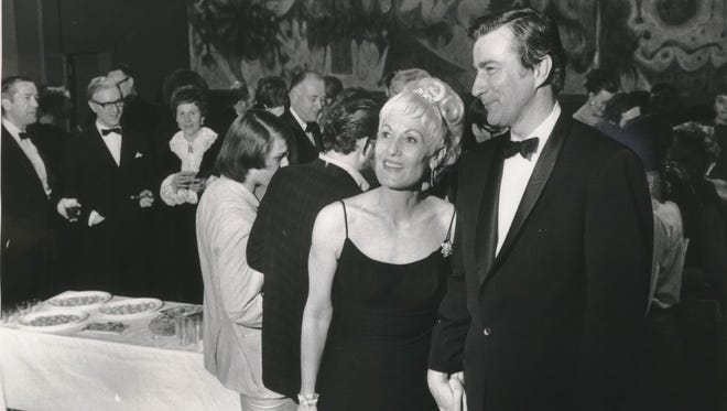 Theater professor Leo M. Jones (right) and his wife Kay host a reception at Marquette in 1969. Jones died Aug. 22 at age 94.
