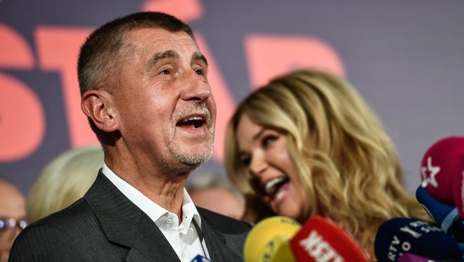 Andrej Babis Slovak-born billionaire and leader of the ANO movement, speaks next to his wife Monika after the first results prognosis of Czech parliamentary elections at the ANO movement election event in Prague, Czech Republic, Oct. 21, 2017.