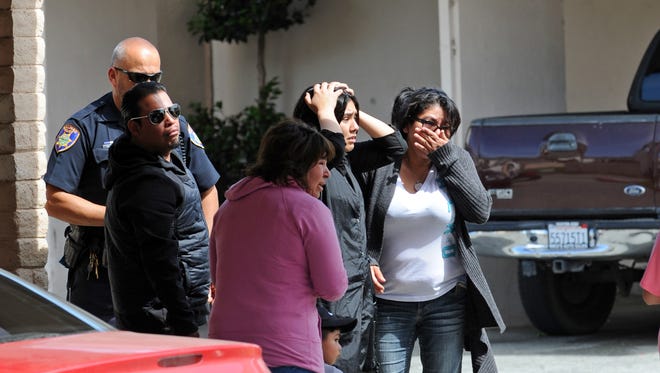 Distraught loved ones at the scene of Wednesday's fatal shooting at 912 Acosta Plaza in Salinas. 