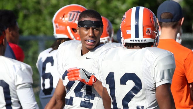 UTEP defensive back Kahani Smith, 24, rests following pass defense drills Wednesday at Glory Field.