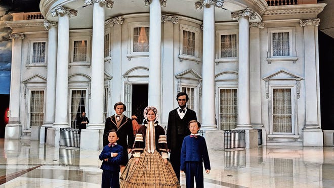 Pose for a photo with President Lincoln and his family outside the White House exhibit.