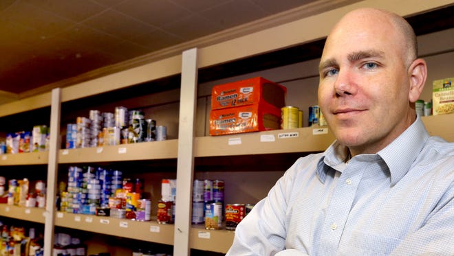 Taylor Loyal, Rutherford County Development Manager for Second Harvest Food Bank of Middle Tennessee, stands in the food pantry at Greenhouse Ministries, on Thursday Sept. 10, 2015, which is one of Second Harvest's 21 partner agencies in Rutherford County. Second Harvest distributes about 2 million pounds of food annually in Rutherford County. 