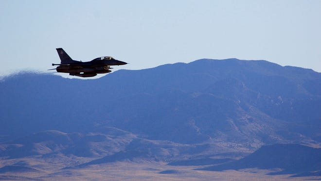 In this March, 2017, photo supplied by Sandia National Laboratories, an F-16C makes a pass over Nevada's Tonopah Test Range after a March test of a mock nuclear weapon as part of a life extension program for the B61-12, near Tonopah, Nev. Scientists at Sandia National Laboratories are claiming success with the first in a new series of test flights that are part of an effort to upgrade one of the nuclear weapons that has been in the U.S. arsenal for decades.