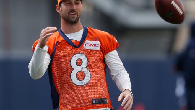 Denver Broncos kicker Brandon McManus tosses a ball during NFL football organized team activities at the team's headquarters Tuesday, May 23, 2017, in Englewood, Colo. (AP Photo/David Zalubowski)