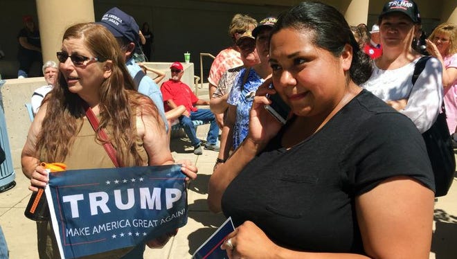 Marisa Duran, right, stands in line with hundreds of other supporters of Republican presidential candidate Donald Trump as they wait for the start of a rally in downtown Albuquerque on Tuesday, May 24, 2016. Trump was making his first campaign visit to New Mexico amid promises of protests. Duran said as a Latina, she's not offended by anything the Republican candidate has said and she supports his call for border security.