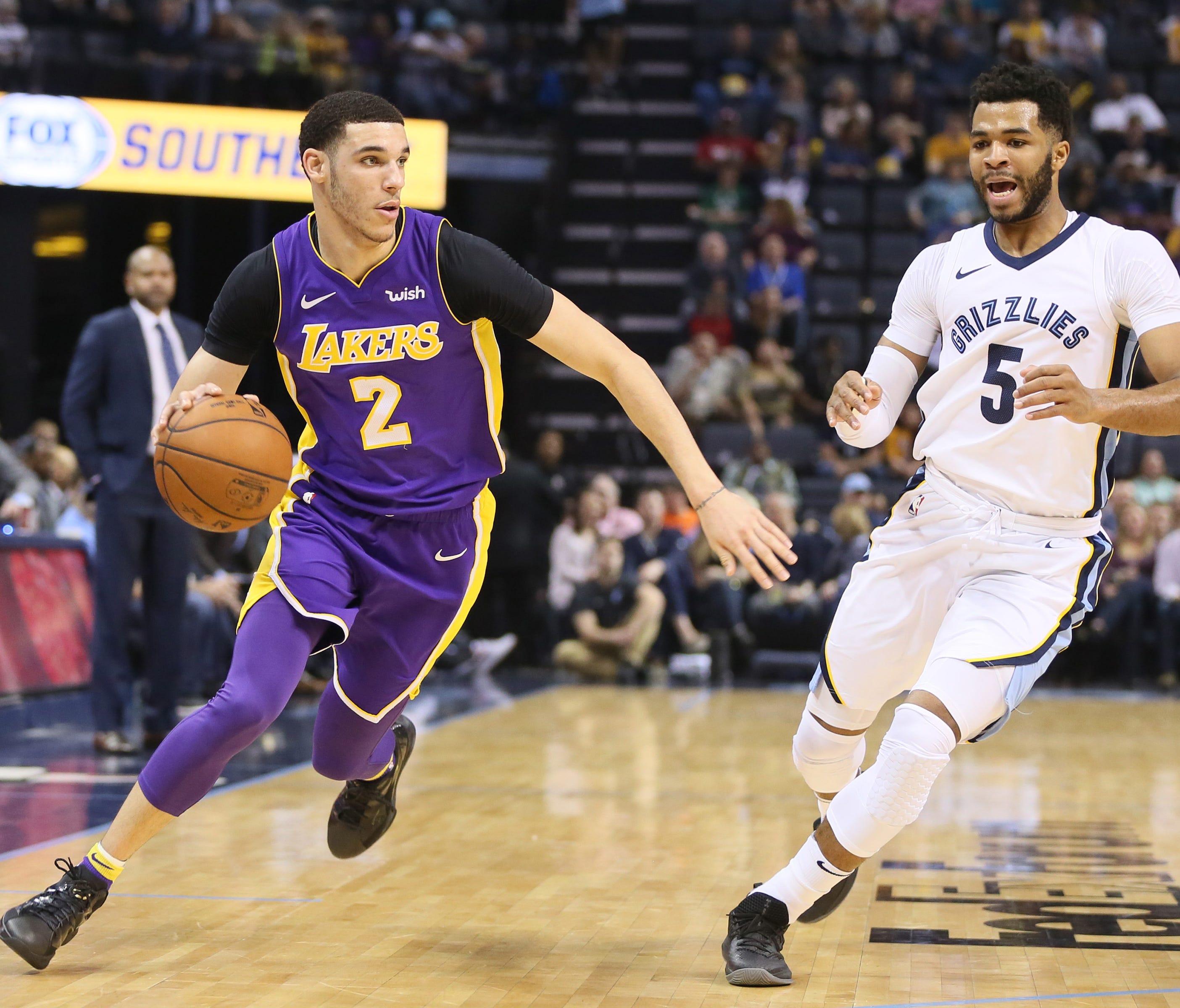 Los Angeles Lakers guard Lonzo Ball (2) drives against Memphis Grizzlies guard Andrew Harrison (5) in the first quarter at FedExForum.