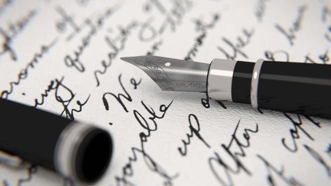 Handwritten letter and fountain pen