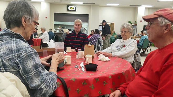 Sue Waller of St. Cloud, Leslie Holm of Sartell, Lorraine Moore of Sauk Rapids and Mel Strack of St. Cloud, pictured from left, chat after eating lunch in December 2015 at Whitney Senior Center.
