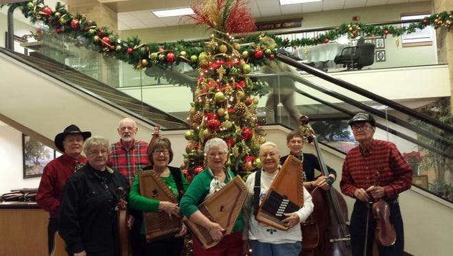 Members of the Big Country Autoharp & Dulcimer Club performed Christmas music at Hendrick Medical Center. From left: Herb Wood, guitar; Marlene Briggs, mountain dulcimer; Taylor Rankin, mountain dulcimer; Carlene Wood, autoharp; Ruth Anna Driggers, autoharp; Ruby McLeod, autoharp; Suzie Steckly, bass; and Bill Burns, fiddle.