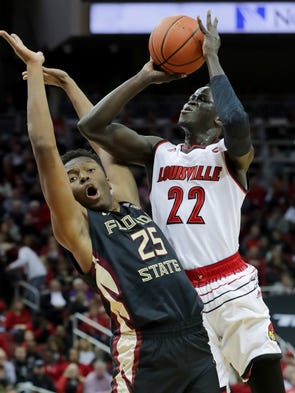 Louisville's Deng Adel draws the foul against FSU's