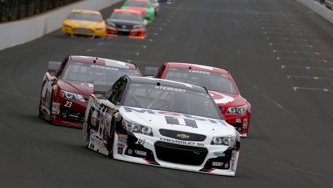 Tony Stewart heads down the stretch midway through the race. Jeff Gordon won his fifth race at the Brickyard 400 at the Indianapolis Motor Speedway in Indianapolis, IN on Sunday, July 27 2014.